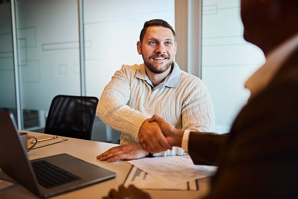 istock Diverse Businessmen Shaking Hands in Meeting for Agreement 2253354024