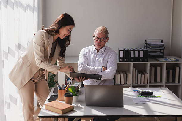 istock Business colleagues collaborating on project documentation in office 2253355281