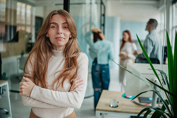 istock Professional adults working together in an office environment with technology and collaboration among colleagues 2253356593