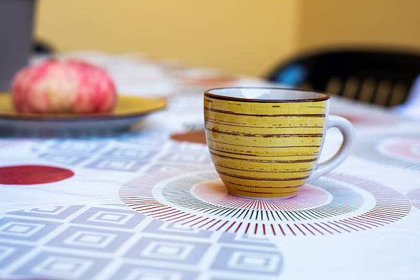 ceramic coffee cup with coffee on the table. Good morning.