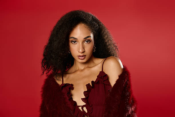 istock Stunning autumn style showcased by a confident Black woman in a studio setting 2253360289