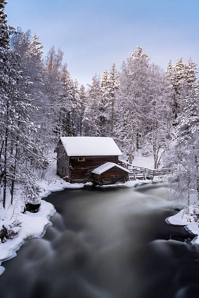 istock Old water mill surrounded by frozen forest, Finland 2253361964