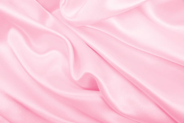 istock Smooth elegant pink silk or satin texture as wedding background. Luxurious background design 2253362508