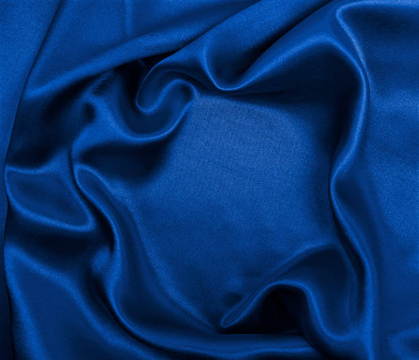 istock Smooth elegant blue silk or satin luxury cloth texture as abstract background. Luxurious background design 2253362531