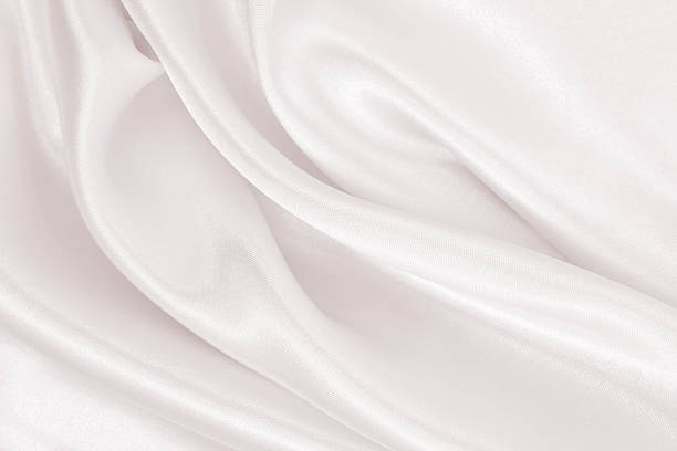 istock Smooth elegant golden silk or satin luxury cloth texture as wedding background. Luxurious background design. In Sepia toned. Retro style 2253362573