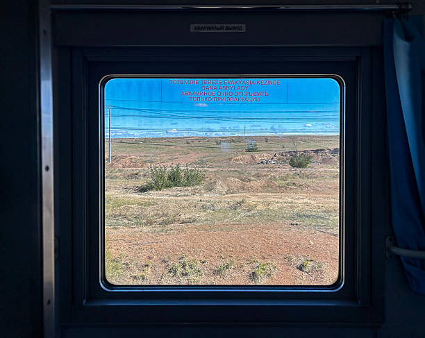istock Train Window View of the Vast Grassland 2253364207