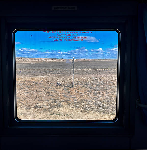 istock Train Window View of the Vast Grassland 2253364283