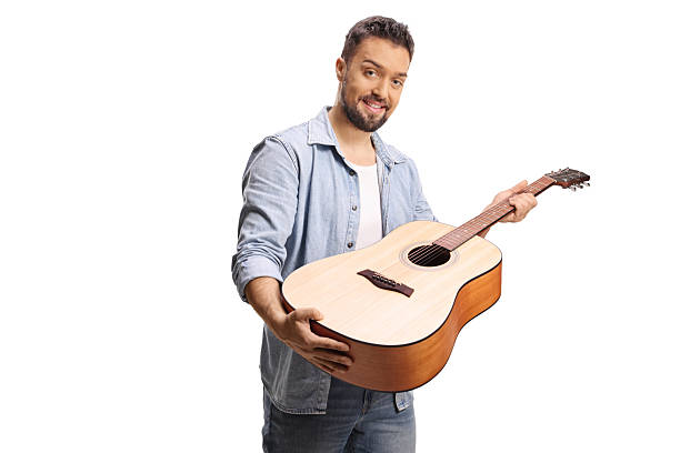 istock Guy checking an acoustic guitar 2253366526