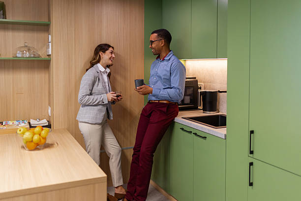 istock Diverse Professionals Socializing in Contemporary Office Break Room 2253367641