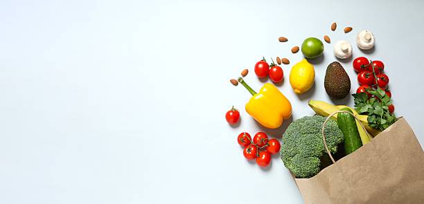 istock Paper bag, vegetables and fruits on gray background, space for text 2253370237