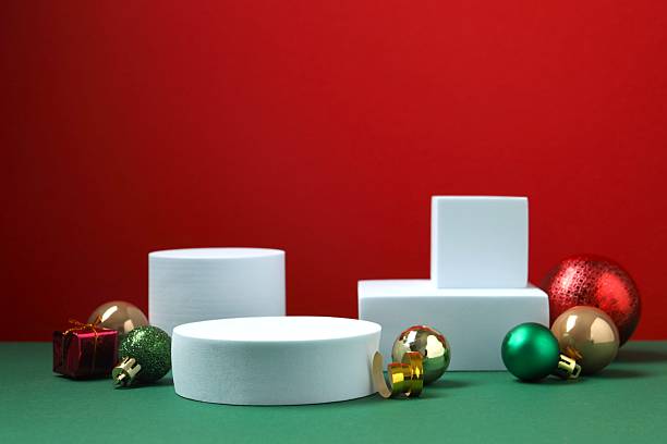 istock Beautiful composition with podiums and Christmas decor on two-tone background 2253370728