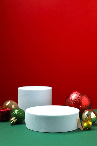 istock Beautiful composition with podiums and Christmas decor on two-tone background 2253370731