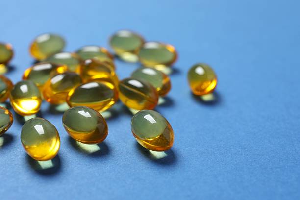 istock Fish oil tablets. Biologically active additives. Omega 3, 6, omega 9, vitamin A, E, D 2253372340