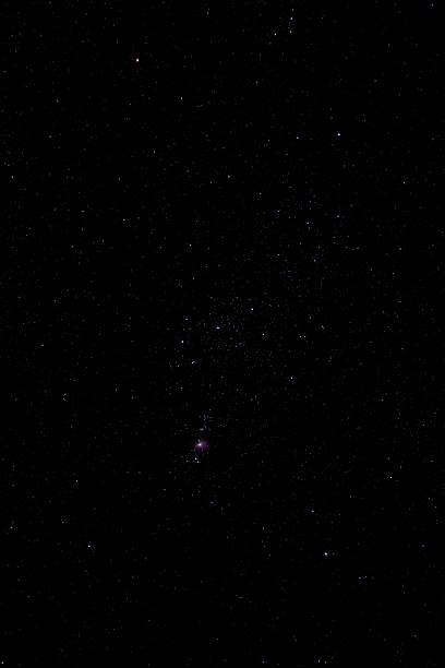 A high-resolution long exposure photograph of the Orion Nebula (Messier 42), showcasing the vibrant stellar nursery, glowing cosmic gases, and distant stars within the Orion constellation. Perfect for scientific, educational, and cinematic space-themed projects.