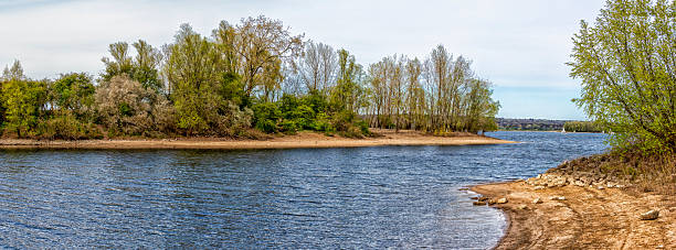 istock Giesbeek lake panorama capturing shoreline and green trees 2253376550