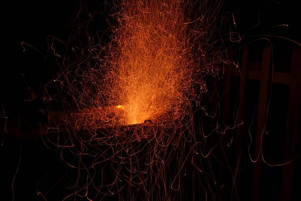 istock Dynamic burst of orange sparks from metalwork 2253376610