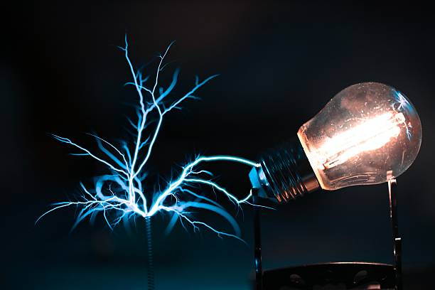 A blue electric current instantly illuminates a light bulb.
