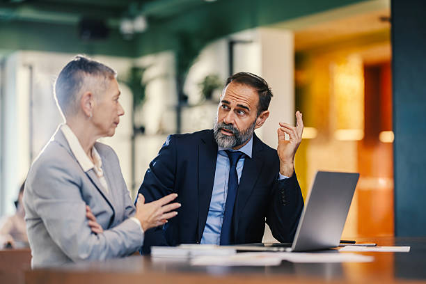 istock Business colleagues discussing work in office meeting 2253378583