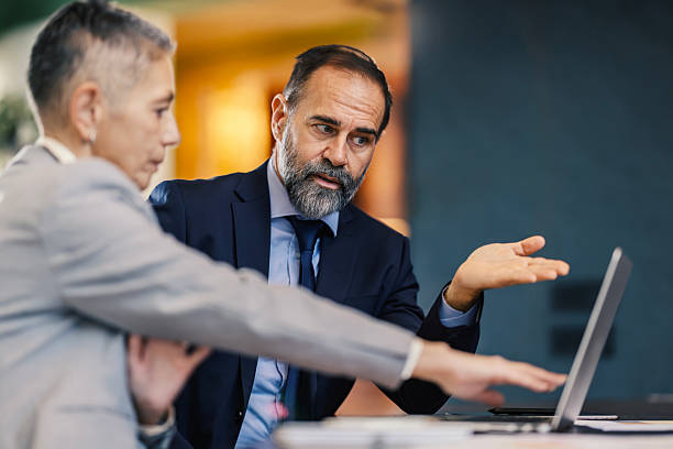 istock Business professionals collaborating on a laptop during a meeting 2253378586