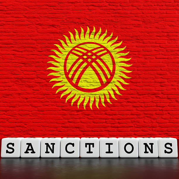 Kyrgyzstan Flag on Bricks Wall With Sanctions