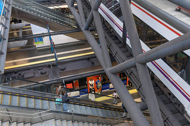 Travellers inside the tropical garden in Atocha's train station, Madrid, Spain.