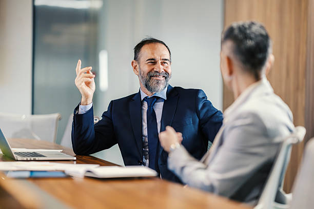 istock Business professionals discussing project during meeting in office 2253378793