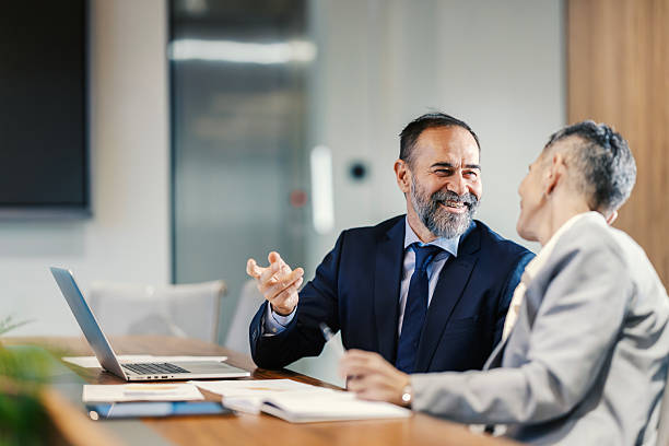istock Diverse business professionals discussing project during meeting in office 2253378797