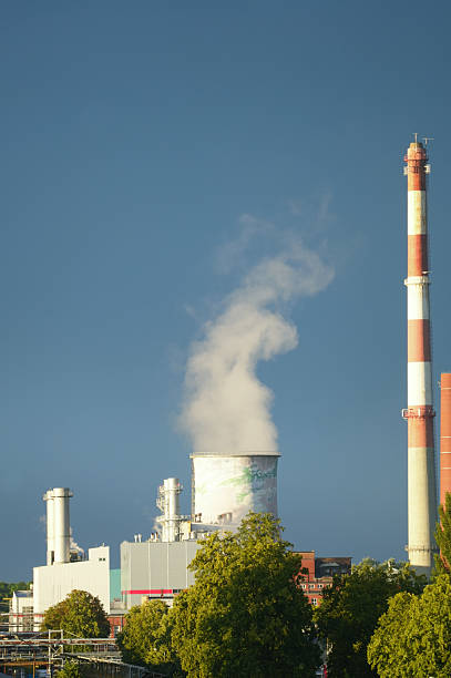 istock Fuming factory close-up on sky background. 2253379852