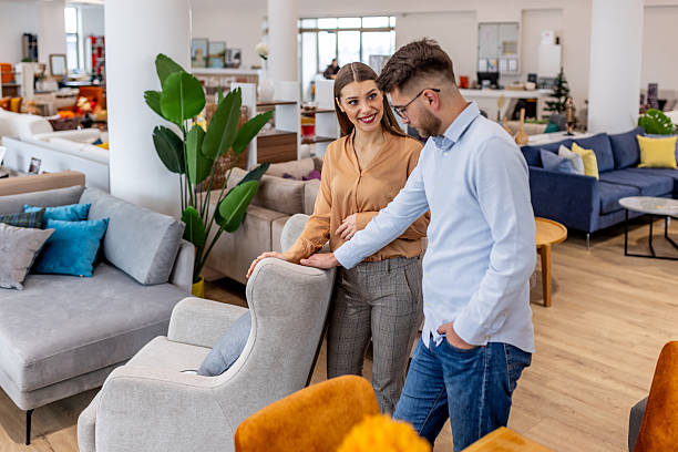 istock Couple in Modern Furniture Store Exploring Sofa Display and Comfortable Seating Options 2253383525