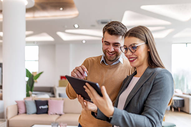 istock Friendly Business Partners Collaborate on Tablet During a Happy Team Discussion in a Modern Office 2253383552