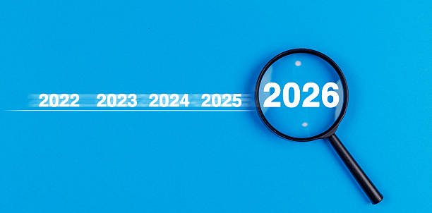 istock Magnifying glass new year 2026 on blue background. Search concept. 2253383864