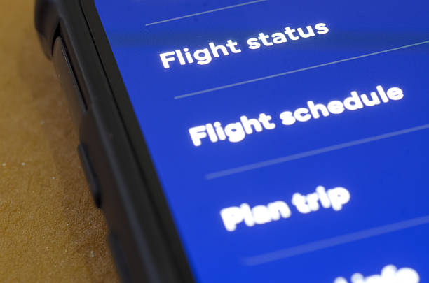 istock Convenient Travel Management via Smartphone Application on Tan Surface 2253385473