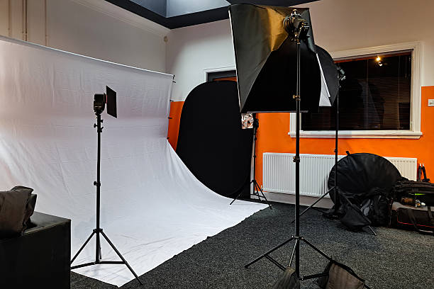 istock Portrait photography setup with hanging white backdrop and softbox lighting 2253387404