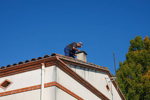 istock A worker stands on a roof fixing a chimney 2253388393