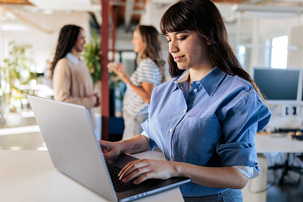 istock Woman Working on a Laptop in a Modern Office 2253389266