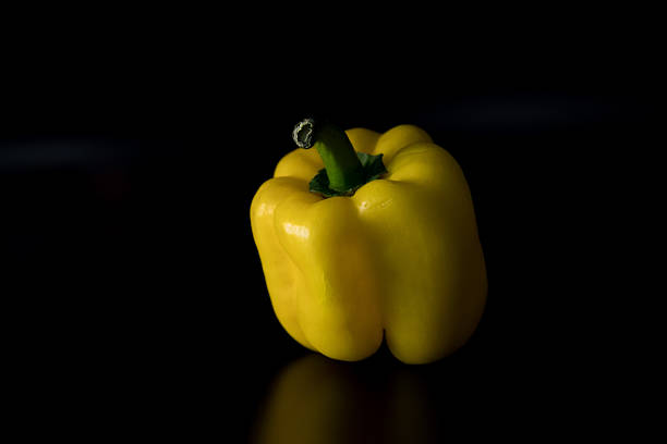 Fresh bell pepper isolated on a black background. Studio food photography highlighting natural shape, texture, and freshness. Suitable for healthy eating, nutrition, and organic food concepts.