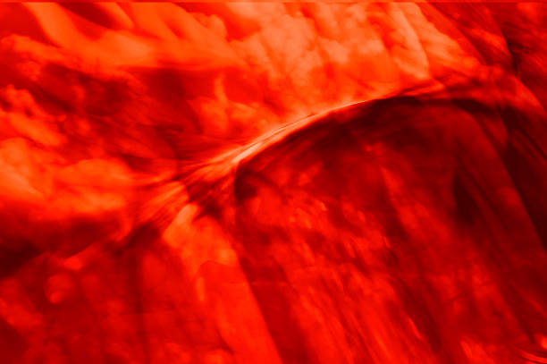 istock Vibrant abstract red  swirl creating a dynamic ethereal background 2253392192