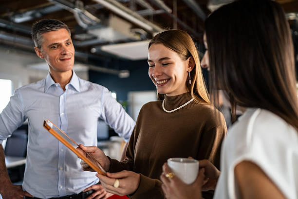 istock Colleagues Collaborating with a Digital Tablet in the Office 2253392329