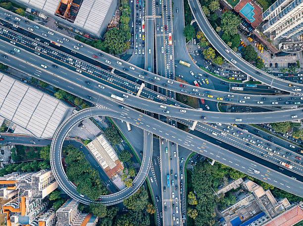 istock Top-down view of a complex city highway interchange with heavy traffic. 2253392522