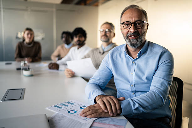 istock Confident Business Leader Sitting at a Meeting Table 2253392852