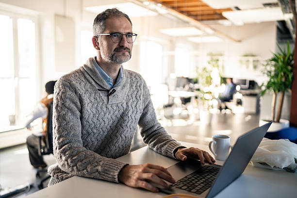 istock Business Professional Working on Laptop in a Modern Office 2253393173