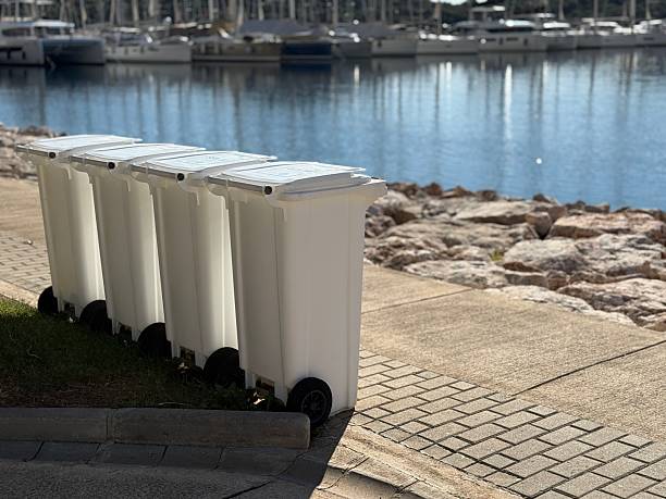 istock Trash bins lined up near waterfront marina, creating an interesting background concept 2253393368