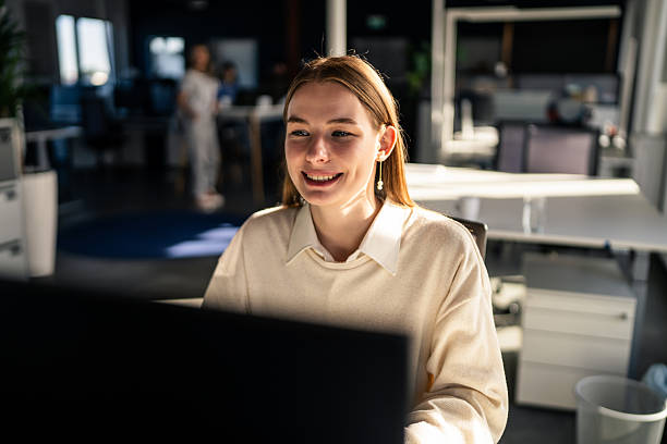 istock Smiling Businesswoman Working on Computer in a Modern Office 2253393557