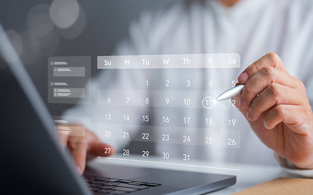 istock Time management concept showing a virtual calendar where business people plan appointments, action plans, reminders, and meeting agendas for effective work management. 2253393805