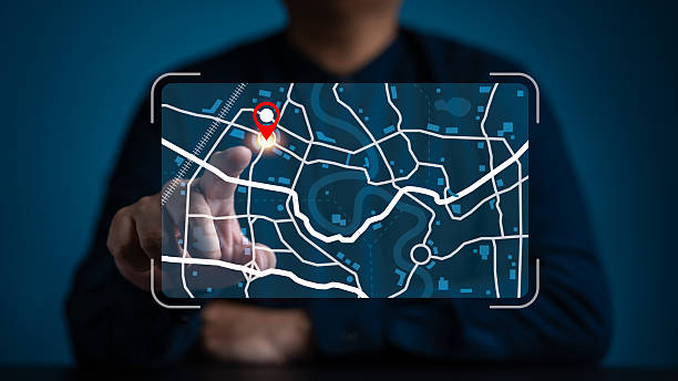 istock Businessman pointing at a digital map interface with a red location pin. Concept for GPS navigation, logistics tracking, smart city technology, route planning, and geographical search data. 2253393838