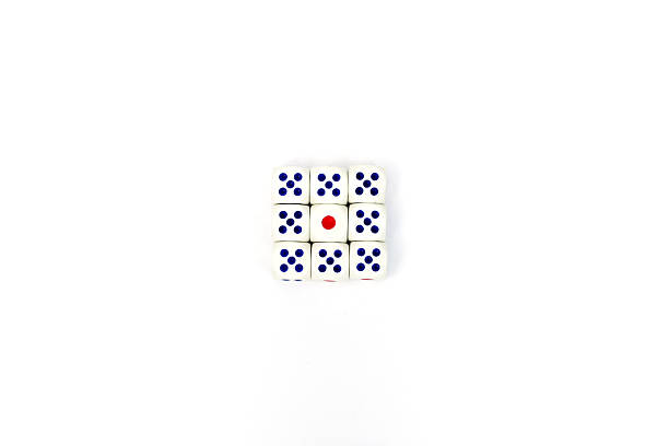 Close-Up Of Stacked Dices Against White Background