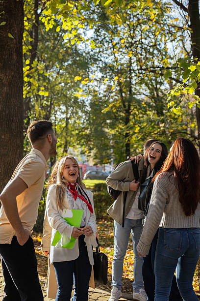 istock College students happily meeting friends on campus 2253395775