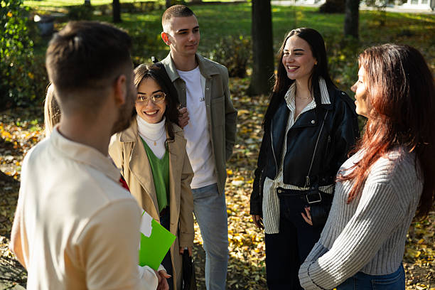 istock Mixed-year college students chatting in front of the campus 2253395780