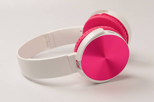 istock Pink and white headphones isolated on white background. 2253396222