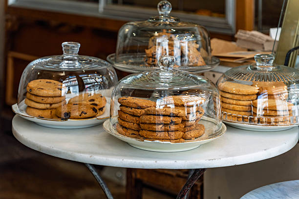 istock Stacked Chocolate Chip Cookies in Glass Domes 2253399531